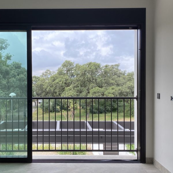 segado arquitectos proyecto córdoba brillante carpinterías correderas enrasadas aluminio piedra paisaje pérgola lujo